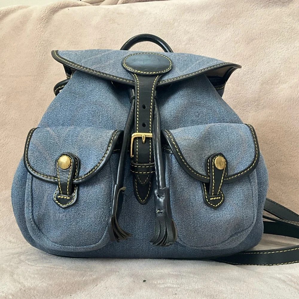 Dooney & Bourke Vintage Canyon Backpack in blue denim. 10.5”x 9.25”x 4”